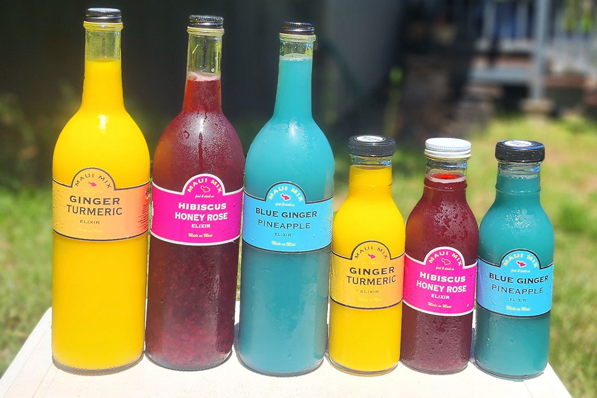 A collection of colorful juice bottles arranged neatly on a table.