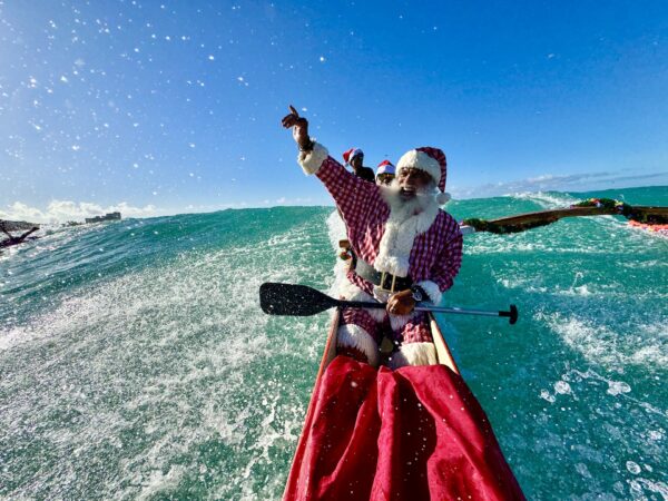 Santa canoeing in Hawaii