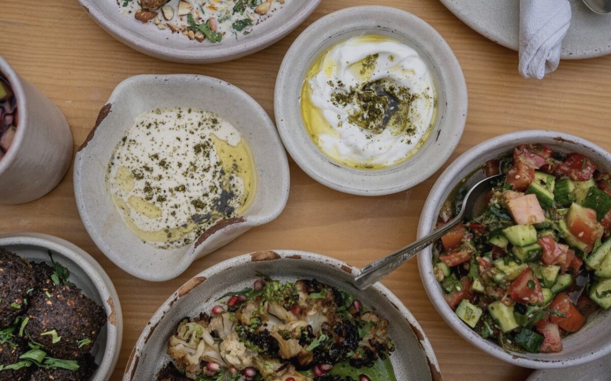 An aerial shot of plates of food and dips.