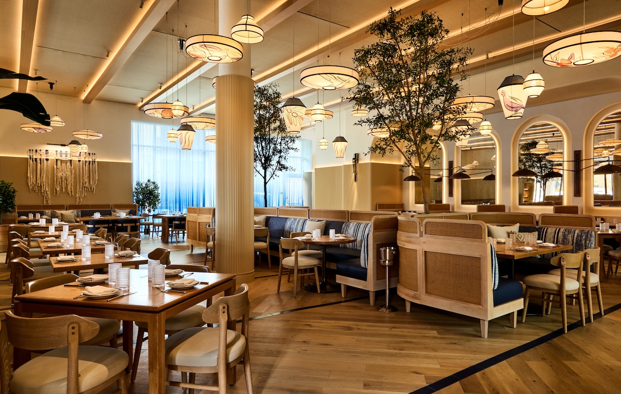 A restaurant with light wood features and accents.