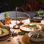 A plate set with lots of fancy plates.