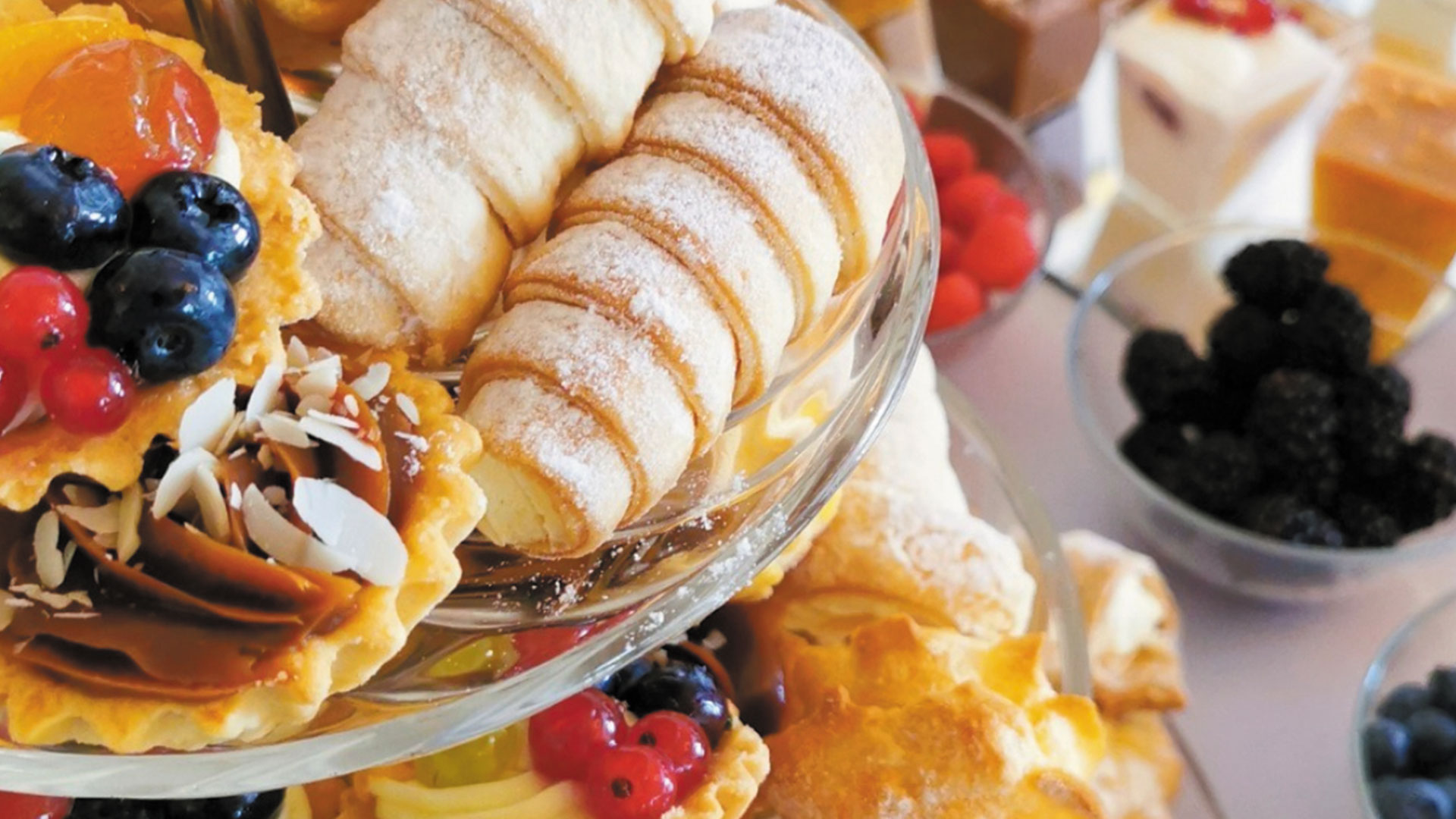 A selection of desserts and pastries on a table at HI Buffet, highlighting diverse flavors and appealing presentations.