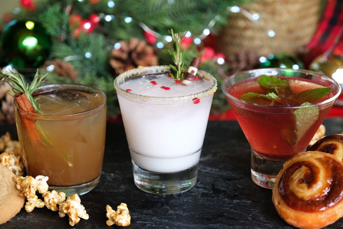 Three different festive Christmas-themed cocktails.