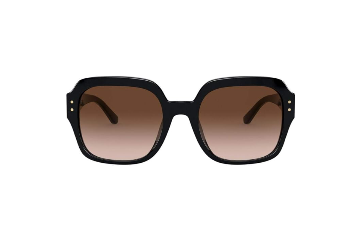 This image shows a pair of women's sunglasses with a black frame, and oversized, warm colored lens.