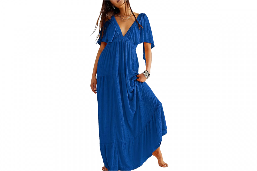 A woman wearing a long, flowing, sea blue dress.