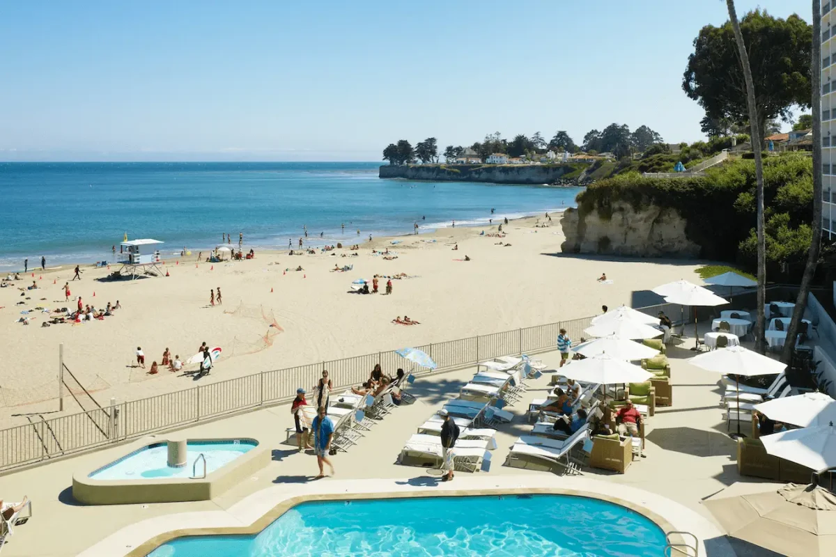 A crowded pool and beach at the Dream Inn in Santa Cruz, California.