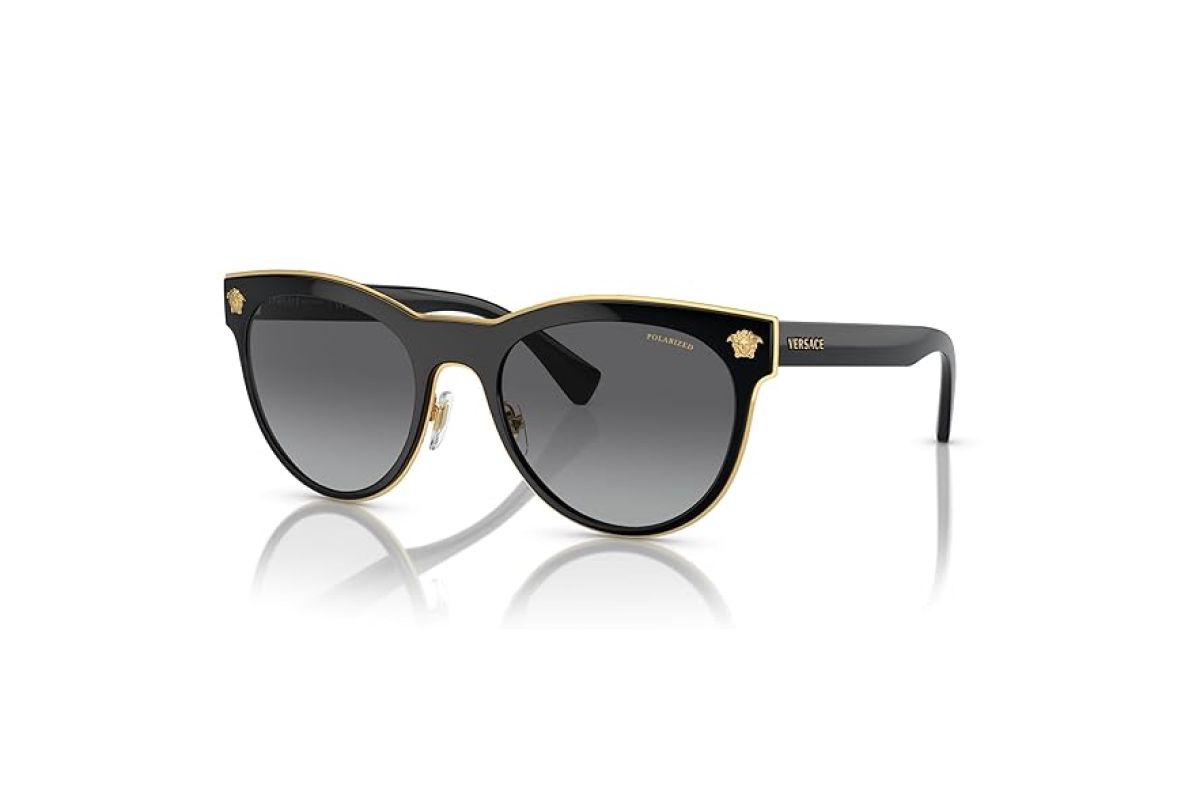 This image shows a pair of women's sunglasses with a black frame, gold trim and smoky grey lens.